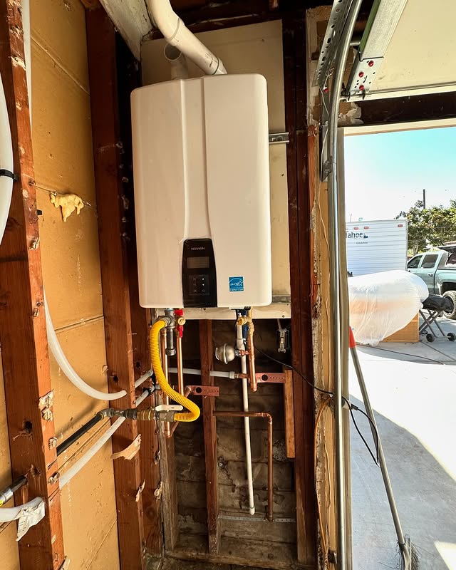 Navien tankless water heater installed by Next Level Plumbing in an Oceanside garage