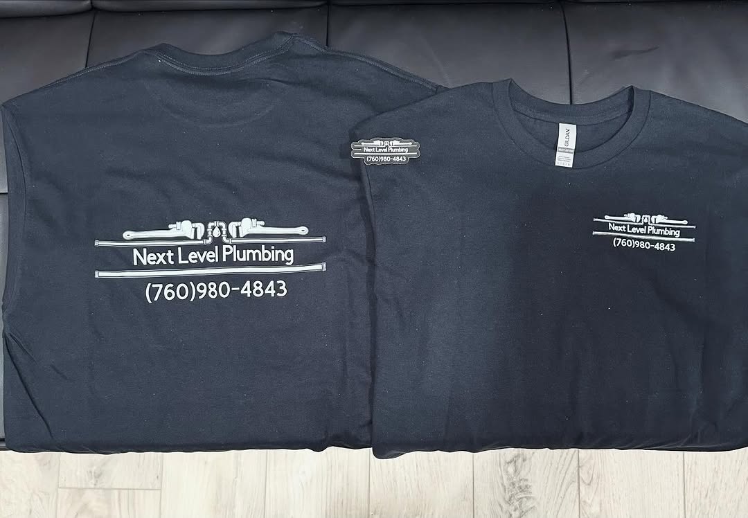 Next Level Plumbing crew shirts with the company logo and phone number